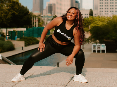 Photo of fitness instructor posing outside to promote Cardio Hip Hop at MLK Dream Center